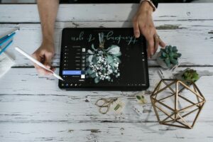 Photographer using best AI CRM for photographers in 2026 to manage client bookings on tablet