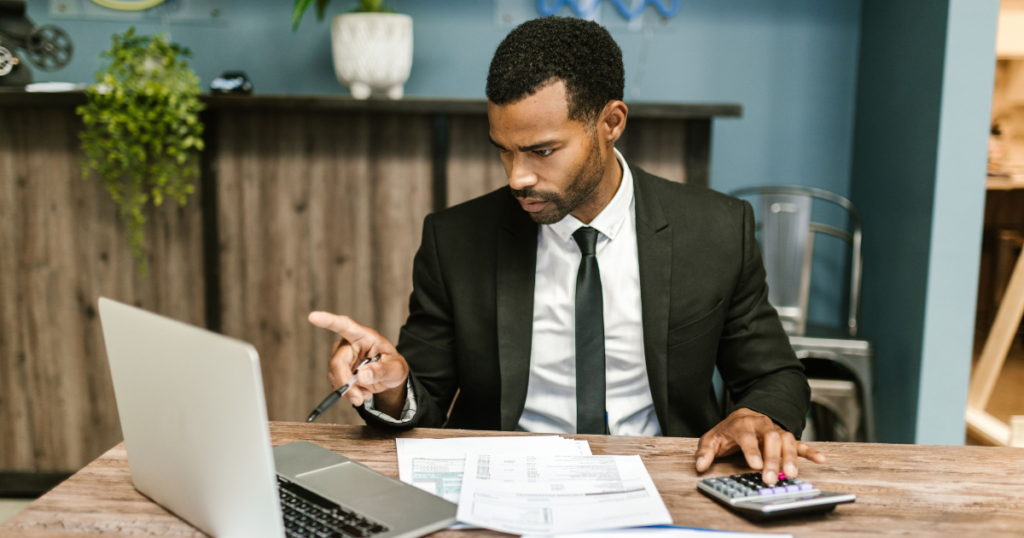 food truck owner reviewing ai accounting software for food trucks monthly financial reports on laptop