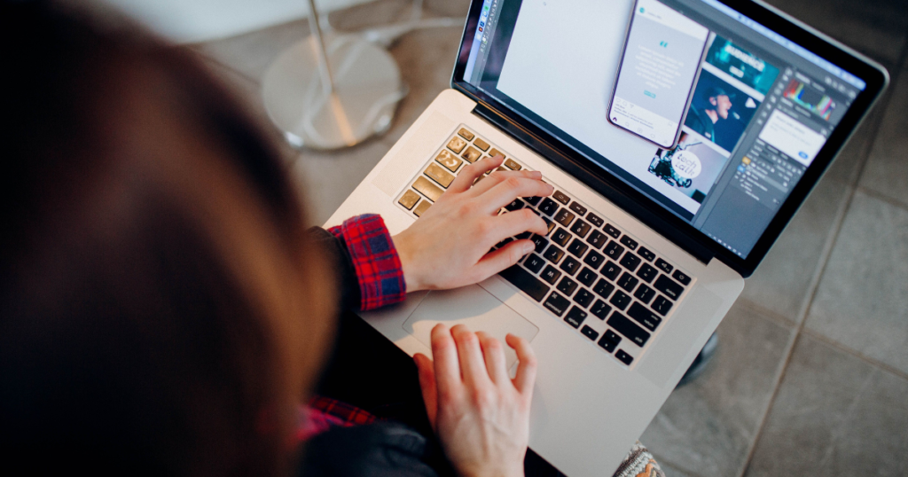 freelancer learning how to use ai writing tools for freelancers on a laptop at a home office desk